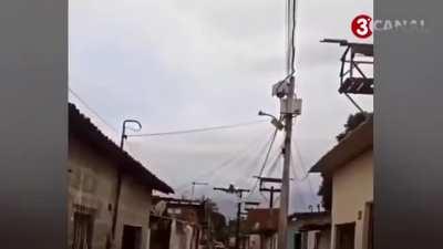 Plane flying close to the houses in Recife, Brazil