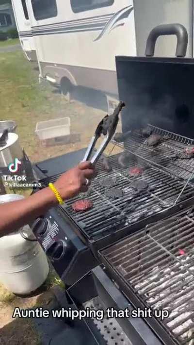 Aunt using the grill. 