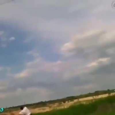 Guy throwing copper wrapped rock on power line