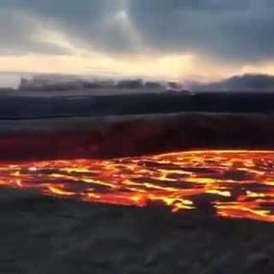 Incredible close up footage of a fast flowing river of lava rushing from Hawaii's Kilauea volcano