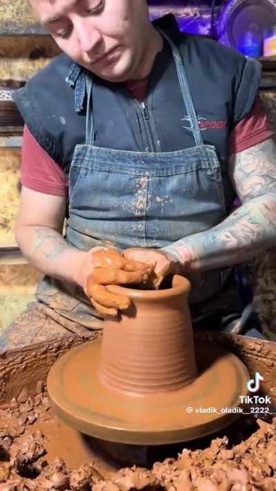 How easily this guy throws pottery