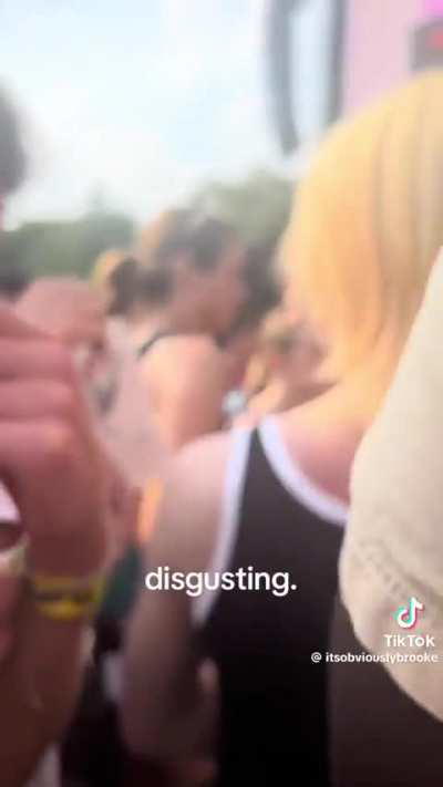 Lady gets chastised and kicked out of Lollapalooza after peeing on the ground