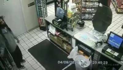 Cashier makes himself ready after seeing a suspicious guy outside his shop.