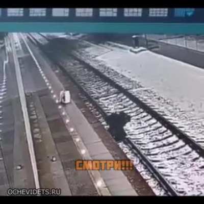 Drunk Man falls on Train Tracks