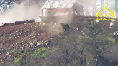 Harakat Sham al-Islam (HSI) militant advancing uphill gets sprayed down from close range by regime soldier, Syria, April 2014