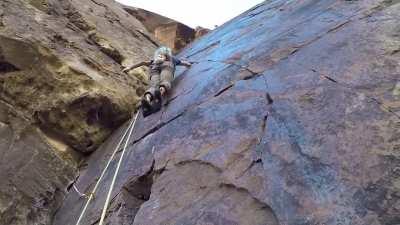 Solo climber passes rock climber.