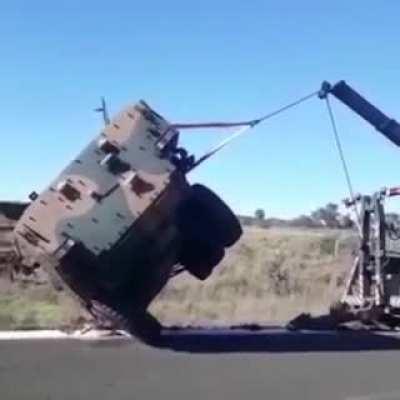 Truck Crane overturns after trying to rescue Guarani Armored Personnel Carrier, this happened in Brazil.