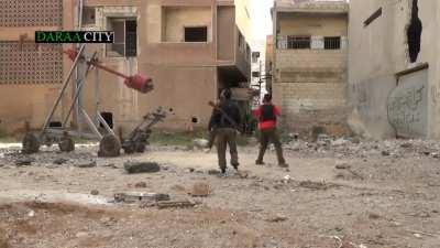 Early Syrian civil war, rebels use makeshift catapult and tribuchet to launch explosive ordinance on government troops 