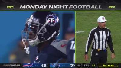 After Ryan Tannehill's pass deflects off of Micah Hyde's helmet, Tennessee Titans receiver Julio Jones makes the catch off the ricochet while managing to stay inbounds