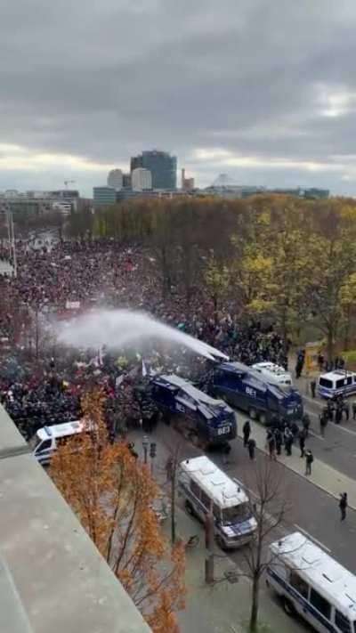 German Riot Police washing down the dirty humans after a long day of protesting