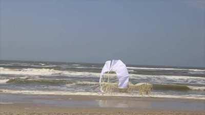 Windsailing walking machine on the beach