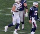 Joey Bosa of the Los Angeles Chargers meets with Tom Brady