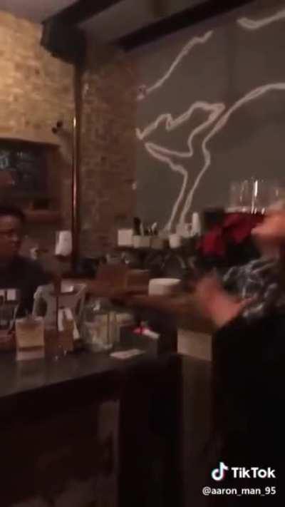 Crazy woman tries to tell a barista that she is better than that job.