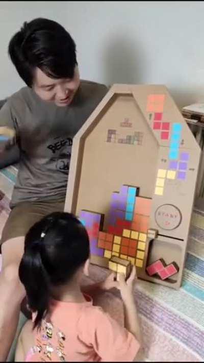 A cardboard Tetris a dad made for her daughter