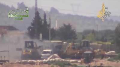 Ahrar al-Sham engage an SAA tank tucked amongst construction equipment using a captured T-55 - al-Nayrab - 2013