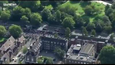 Someone says &quot;the death is irreversible and the fact is she is trapped&quot; during the queen's funeral procession