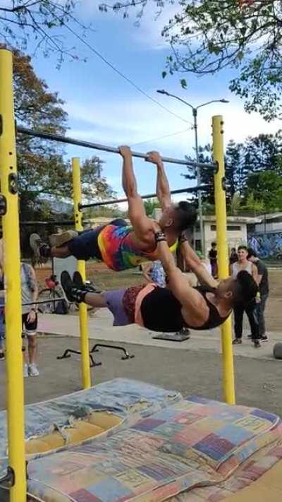 My friend and I performing a double Front Lever Walk