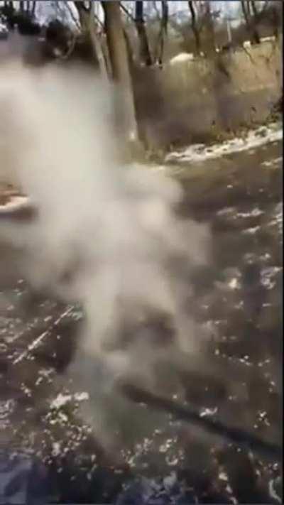 Guy is amazed at reaction to boiling water in cold air.