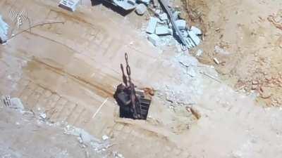 Hamas militant peaks out of tunnel with RPG, immediately gets sprayed 