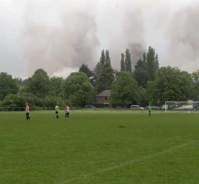 Four giant cooling towers of a power station are getting toppled.