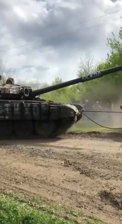 A captured Russian TOS-1 tows a captured Russian T-72 in the Kharkiv Region - September 2024