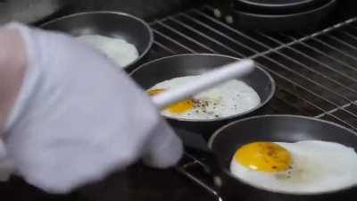 Assembly of American style Cheeseburgers in a Korean Restaurant