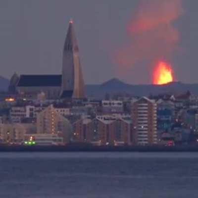 🔥Iceland town with a Volcano erupting in the background