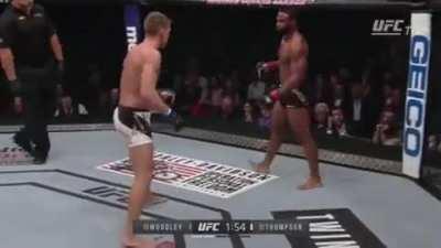 Tyron Woodley and backing up against the cage. Name a more iconic duo.