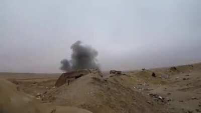 A Kurdish fighter has an interesting reaction to ISIS artillery landing close by.