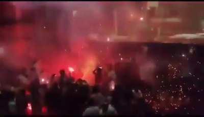 People in India celebrating an actor’s entry by bursting fire crackers inside cinema hall. 