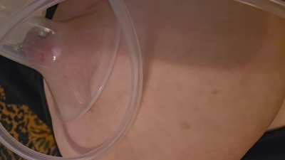 Swollen pierced nipples being pumped with breast milk pump for pleasure on deepest hardest suction setting, 10 minutes in