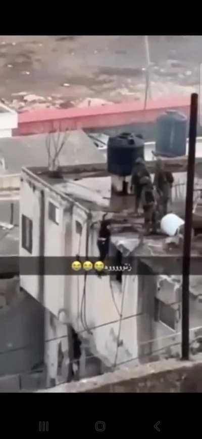 IDF pushing a man off a roof