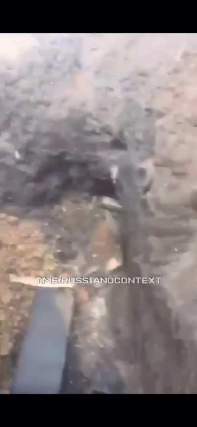 Russian soldiers films his burned trench. Possibly the fire was caused by ukranian drones. 