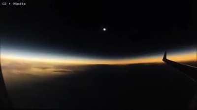 Solar eclipse seen from a plane