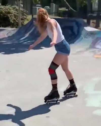 Rollerskater at skate park going backwards and does a flip for the finish.