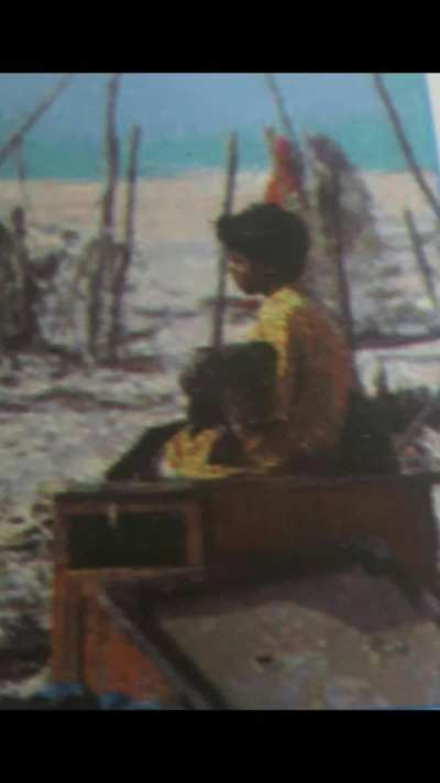 Boy sitting with his dog after the 26 December 2004 tsunami 