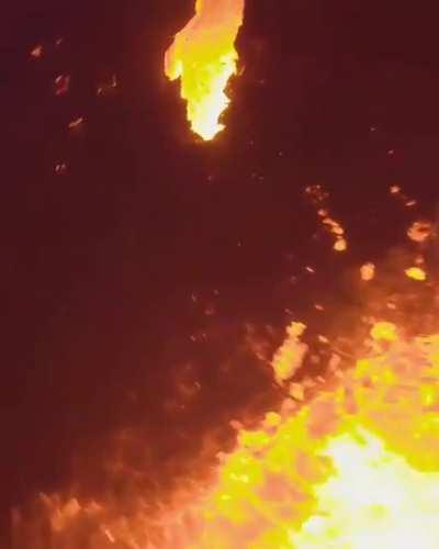 Drone flies over erupting volcano