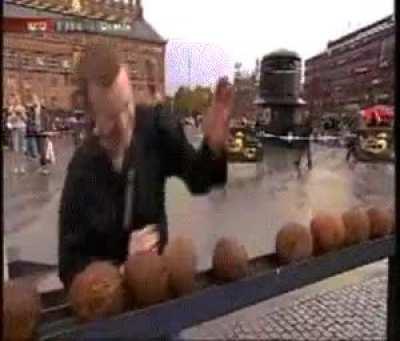 Man fails spectacularly at chopping coconuts with his hands while on live TV