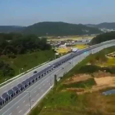 In South Korea, the solar panels in the middle of the highway have a bicycle path underneath..cyclists are protected from the sun, isolated from traffic, and the country can produce clean energy.