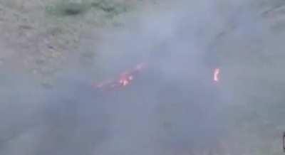 Russian soldiers engulfed in flames run out of their crippled armoured vehicles.