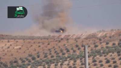 Opposition BGM-71 TOW team successfully destroys an SAA bulldozer building a berm - Aleppo - 7/28/2014