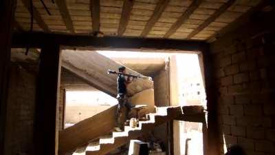 FSA fighter targeting a purported Syrian Army BMP with an RPG - Deir ez-Zor - 7/1/2012