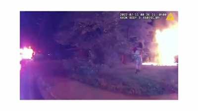 25 yo pizza delivery man runs into burning house, saves four children who tell him another might be in the house. He goes back in, finds the girl, jumps out a window with her, and carries her to a cop who captures the moment on his bodycam