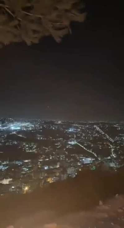 Hezbollah rockets Interceptions above central Israel as seen from the West Bank city of Nabulus (23-10-24)