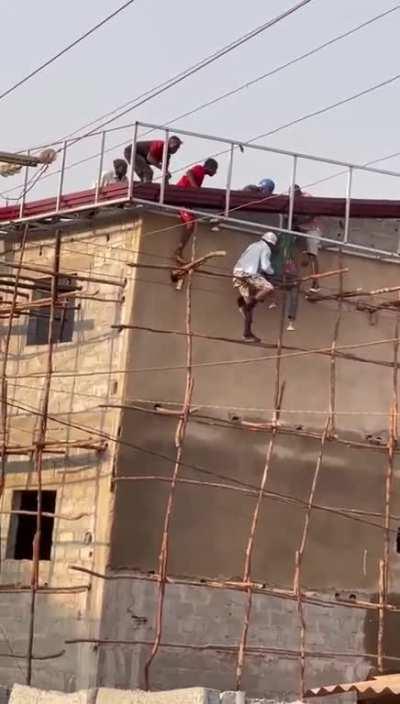 Buddies trying to help an electrocuted man down 