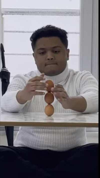 Mohammed Muqbel from Yemen, achieves the Guinness record for the highest stack of eggs (4).