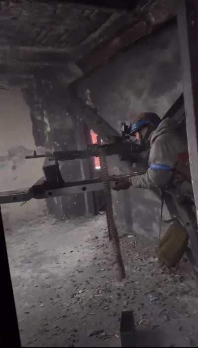 Ukrainian soldier providing fire support with an M240 w/ ACOG (near Avdiivka)