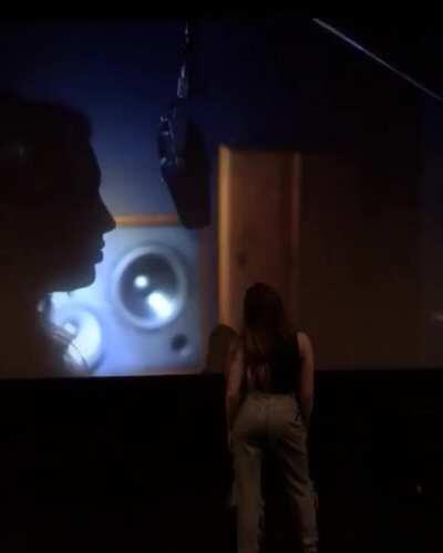 Peyton List watching herself on screen.