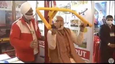 Modiji using shoulder press machine as a pull up bar to do pull ups. This is true innovation