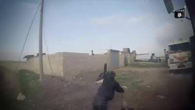 IS fighter catches an FSA rebel in a stopped convoy of civilian trucks